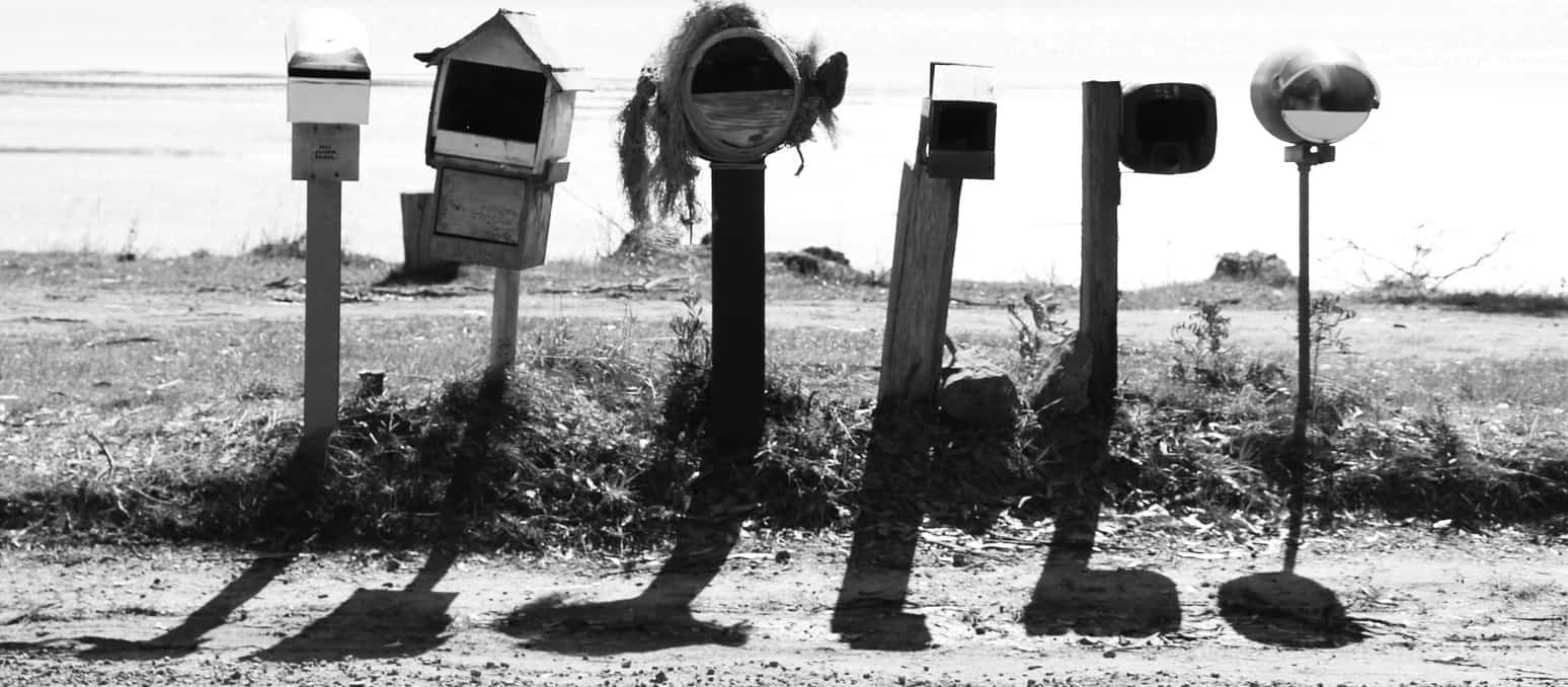 A row of rural letterboxes. Concept of direct mail marketing
